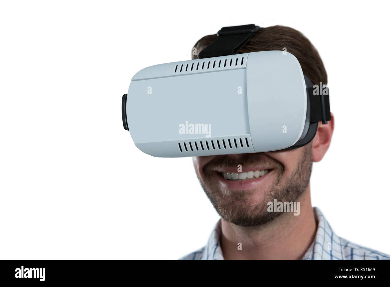 Man using virtual reality headset against white background Stock Photo ...