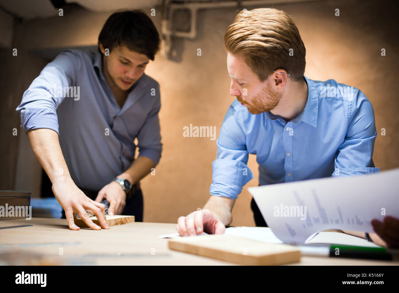 Two designers working together Stock Photo - Alamy