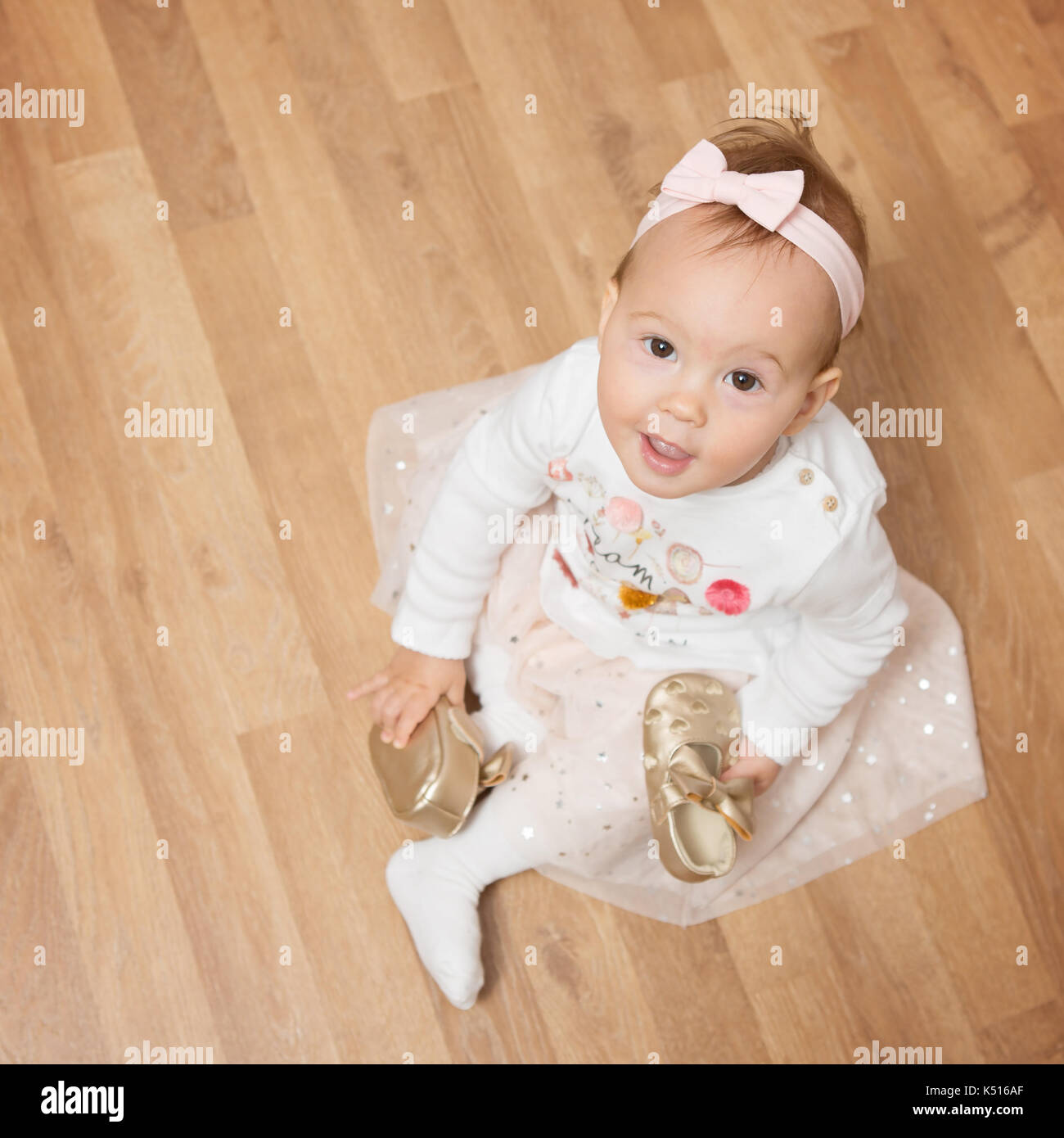 Baby shoes golden hi res stock photography and images Alamy