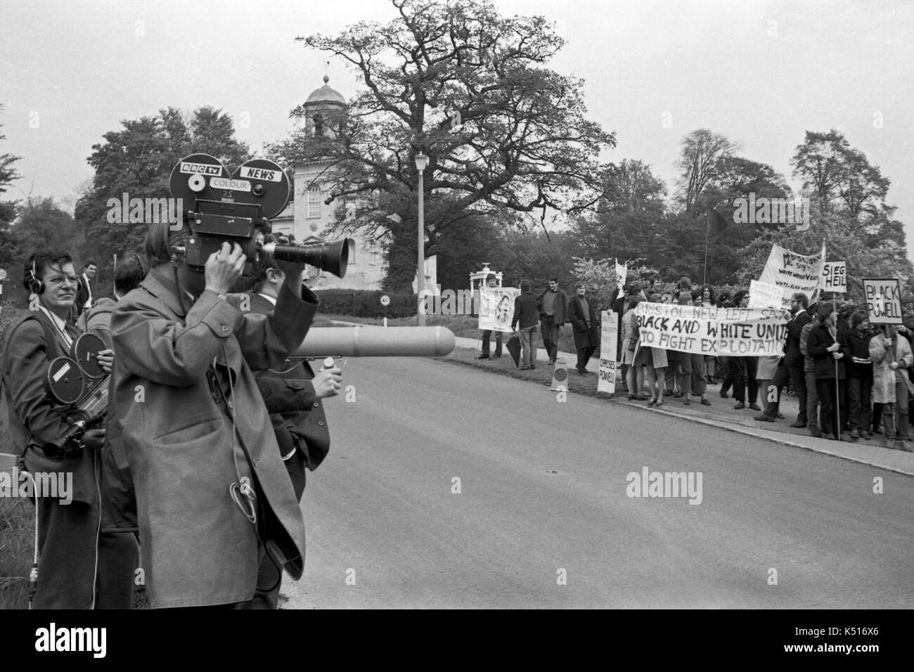 Enoch Powell protest: A  BBC news crew films anti-racism students from Bristol University demonstrating against Enoch Powell MP three weeks after his controversial speech on immigration that became known was the “rivers of blood” speech.  The picket was outside a public meeting in Chippenham in Wiltshire on 11 May 1968.  It was the early days of BBC colour and the crew flew in and out by helicopter. Stock Photo