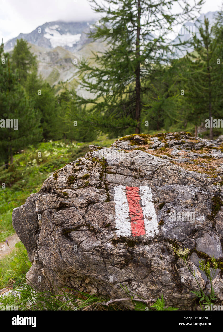 AROLLA, SWITZERLAND - Haute Route trail blaze on hiking trail, in the Pennine Alps. Stock Photo