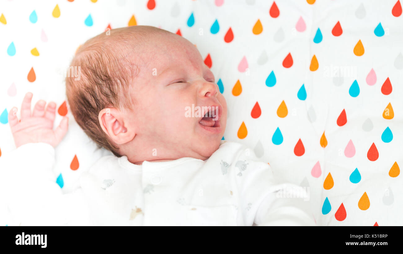 Newborn baby screaming in pain with colics Stock Photo Alamy
