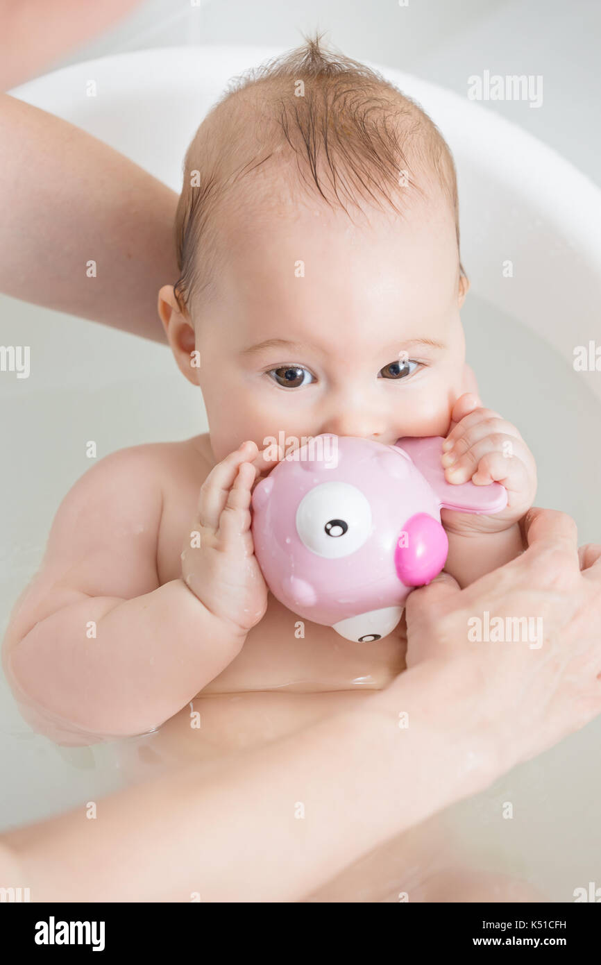 Baby girl in a tub people hires stock photography and images Alamy