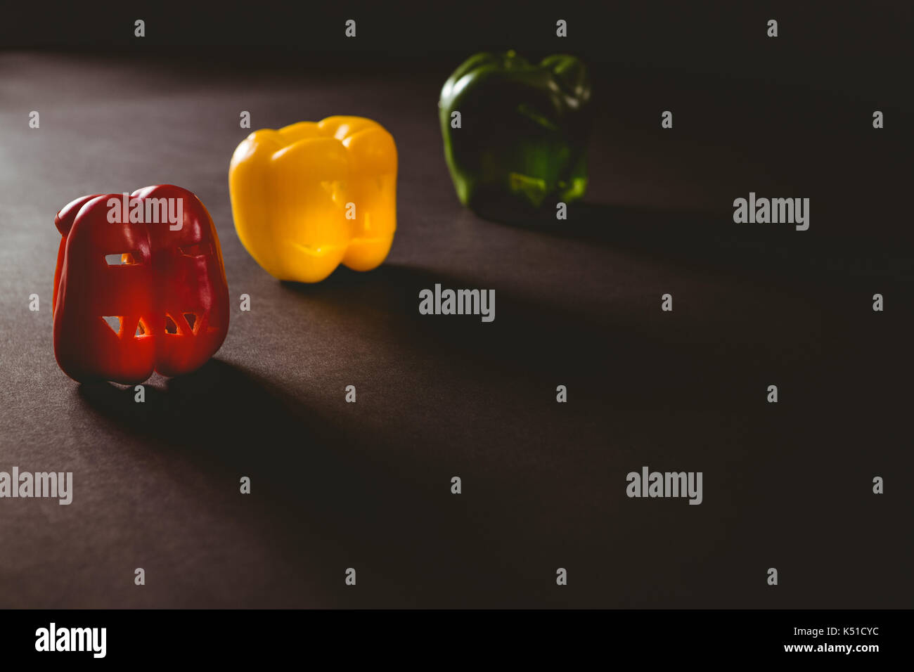 Colorful carved bell peppers on table during Halloween Stock Photo - Alamy