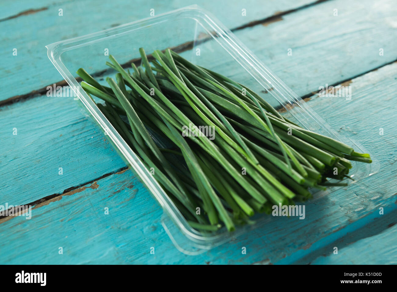 Closeup of garlic chives in plastic container Stock Photo Alamy