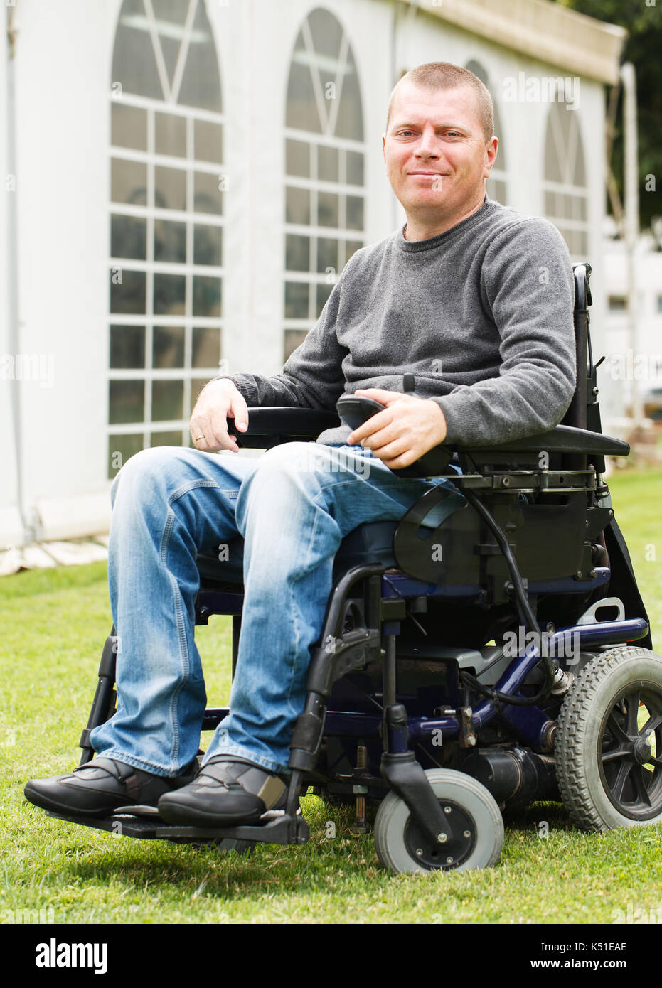 Disabled man smiling in a wheelchair Stock Photo