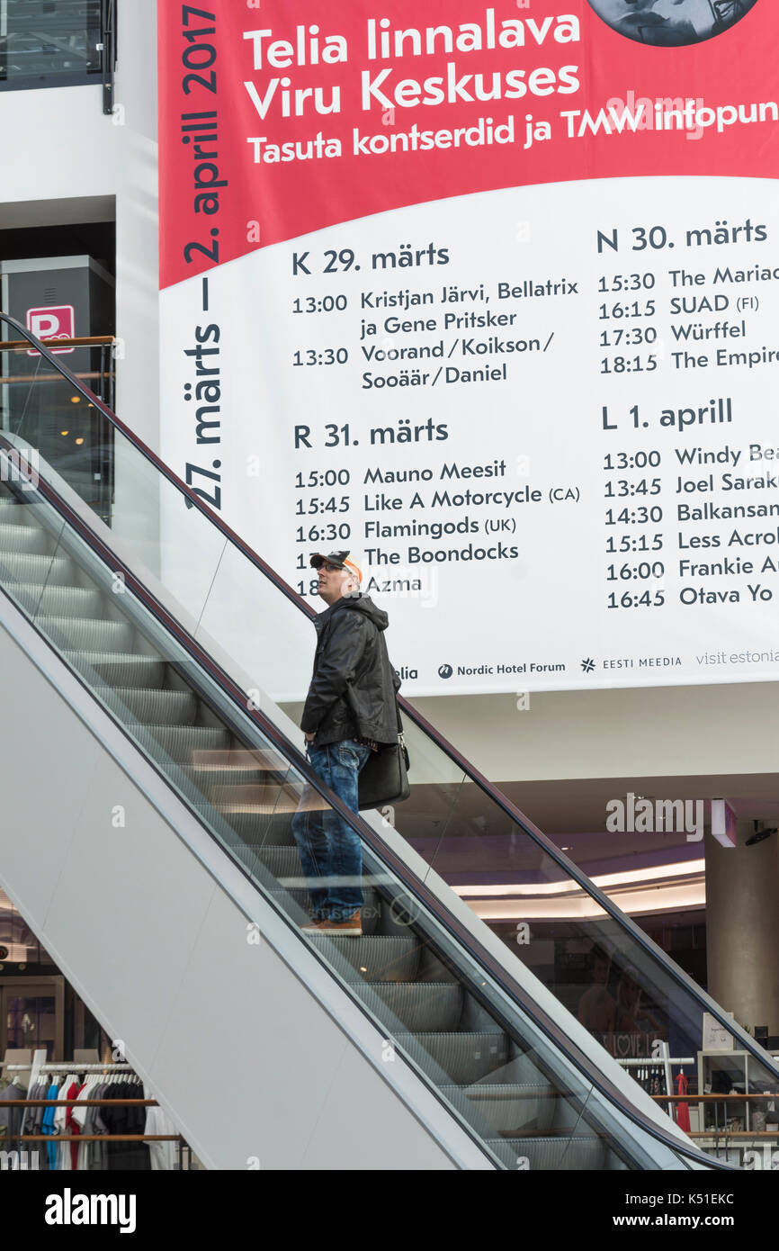 Man on escalator in a Viru shopping center in Tallinn Estonia Stock Photo