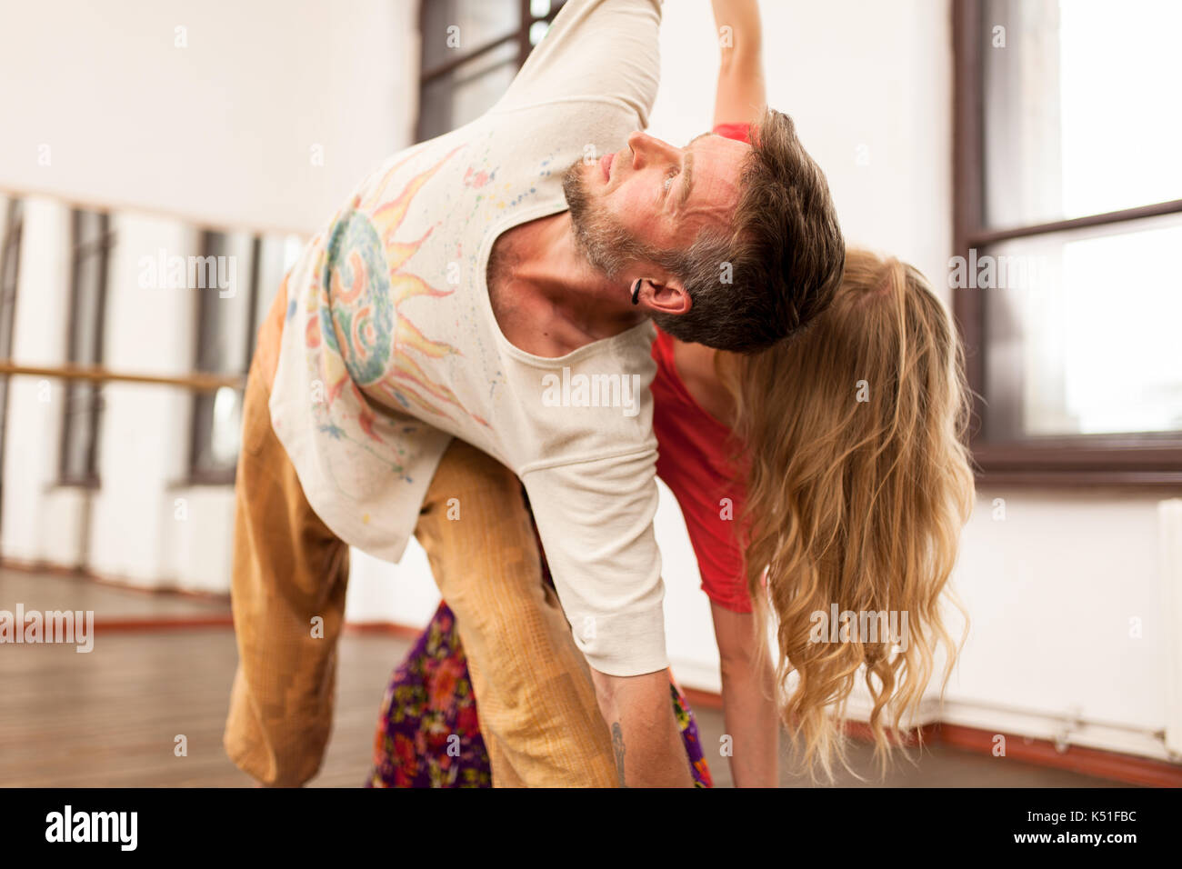 Man and woman practicing partner yoga Stock Photo