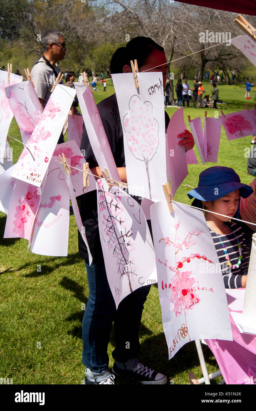 Children's drawings of cherry blossoms decorate a springtime cherry