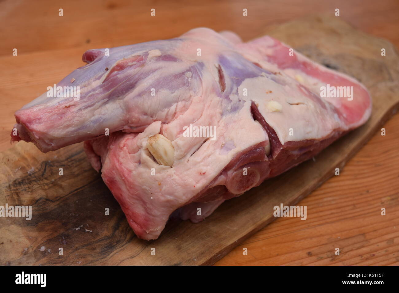 Raw meat on a wooden surface ready to cook Stock Photo