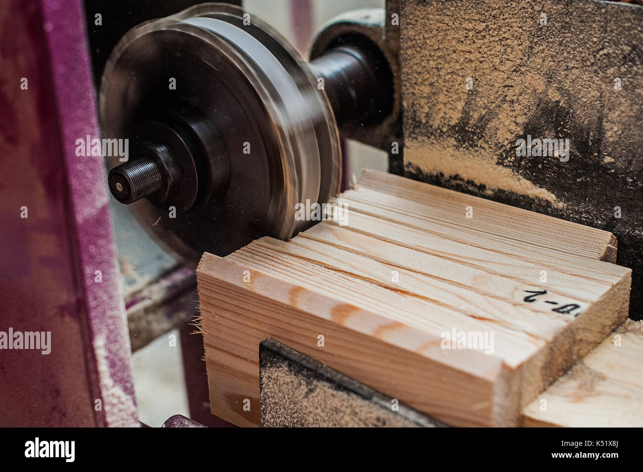 The machine for sampling the groove in a wooden beam with a milling cutter for vertical grooving. in progress one more view Stock Photo