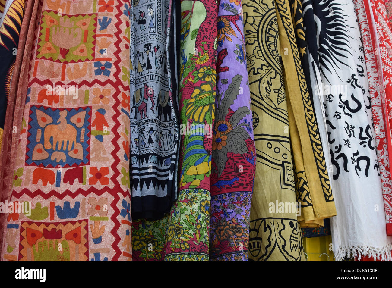 ATHENS, GREECE - MAY 31, 2015: Textiles and shawls from India. Colorful fabric with traditional symbols and patterns. Stock Photo