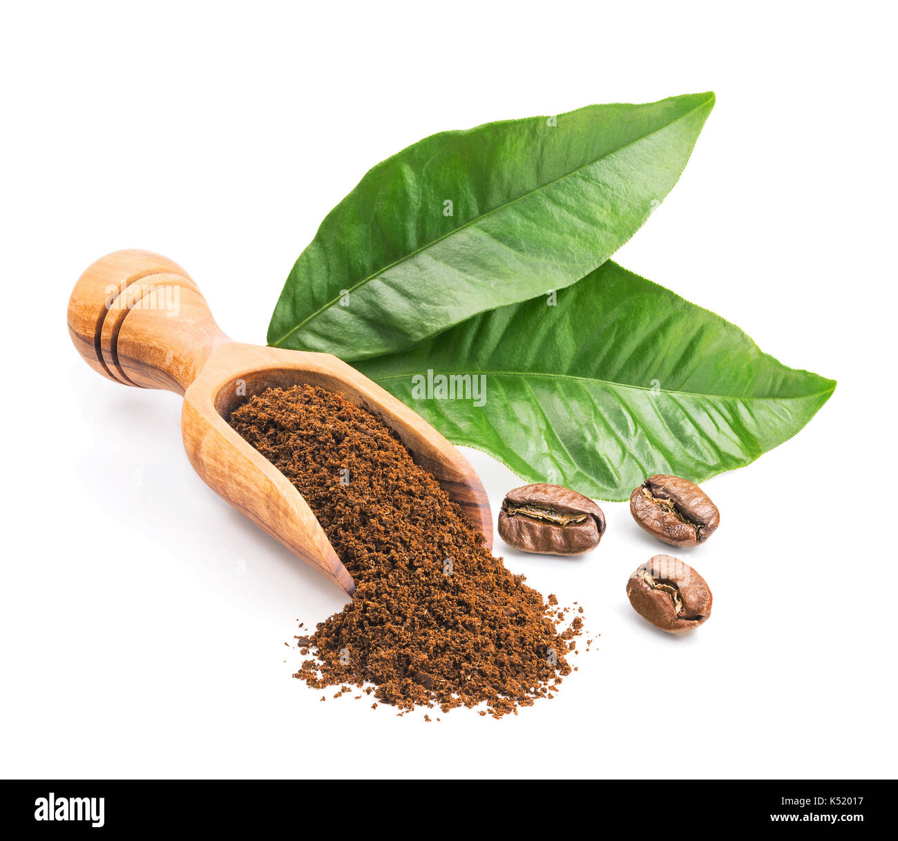 Ground coffee and leaves isolated on white Stock Photo