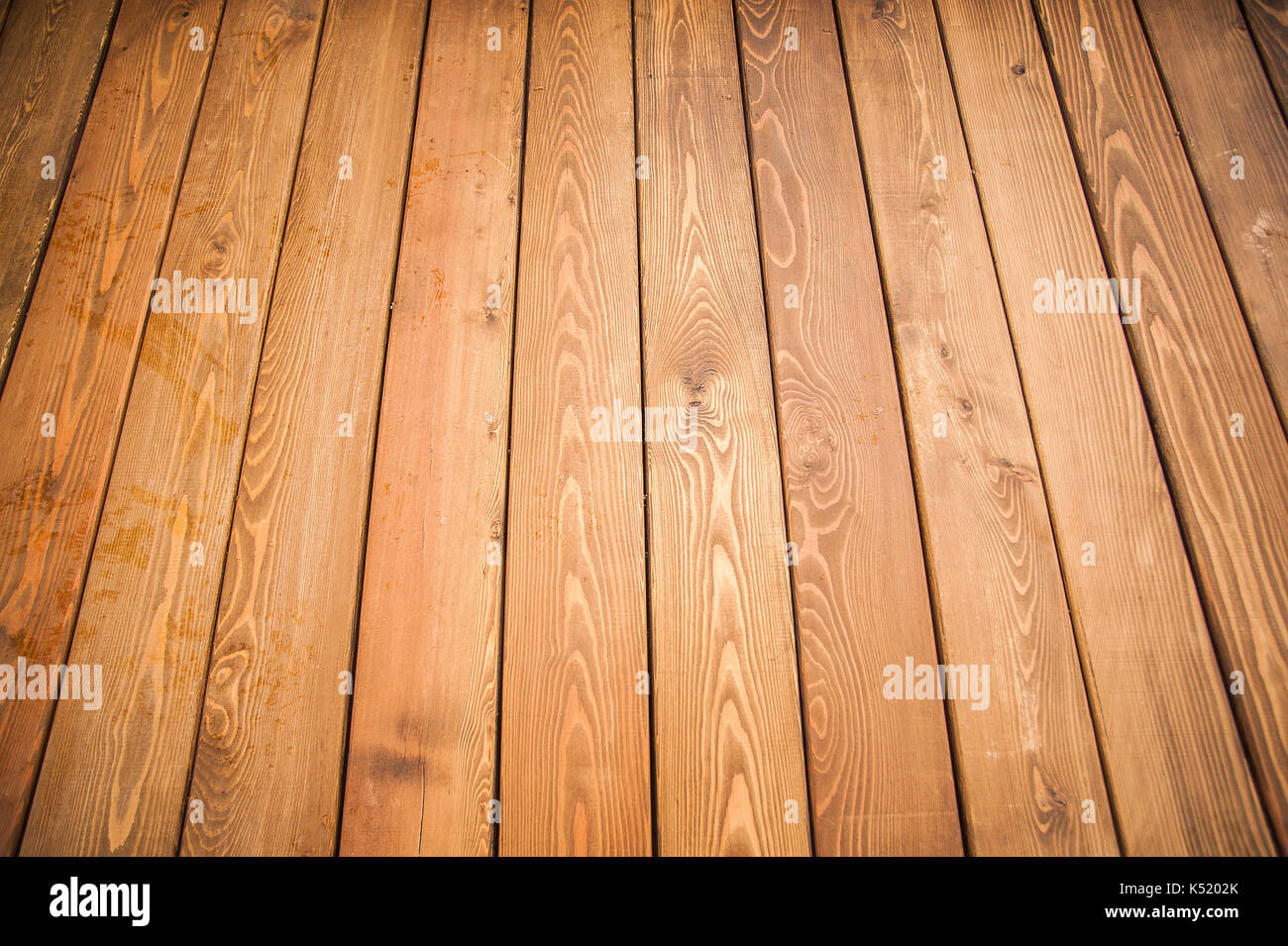 Texture - wooden boards brown color. Texture of a wooden wall from a bar. closeup Stock Photo