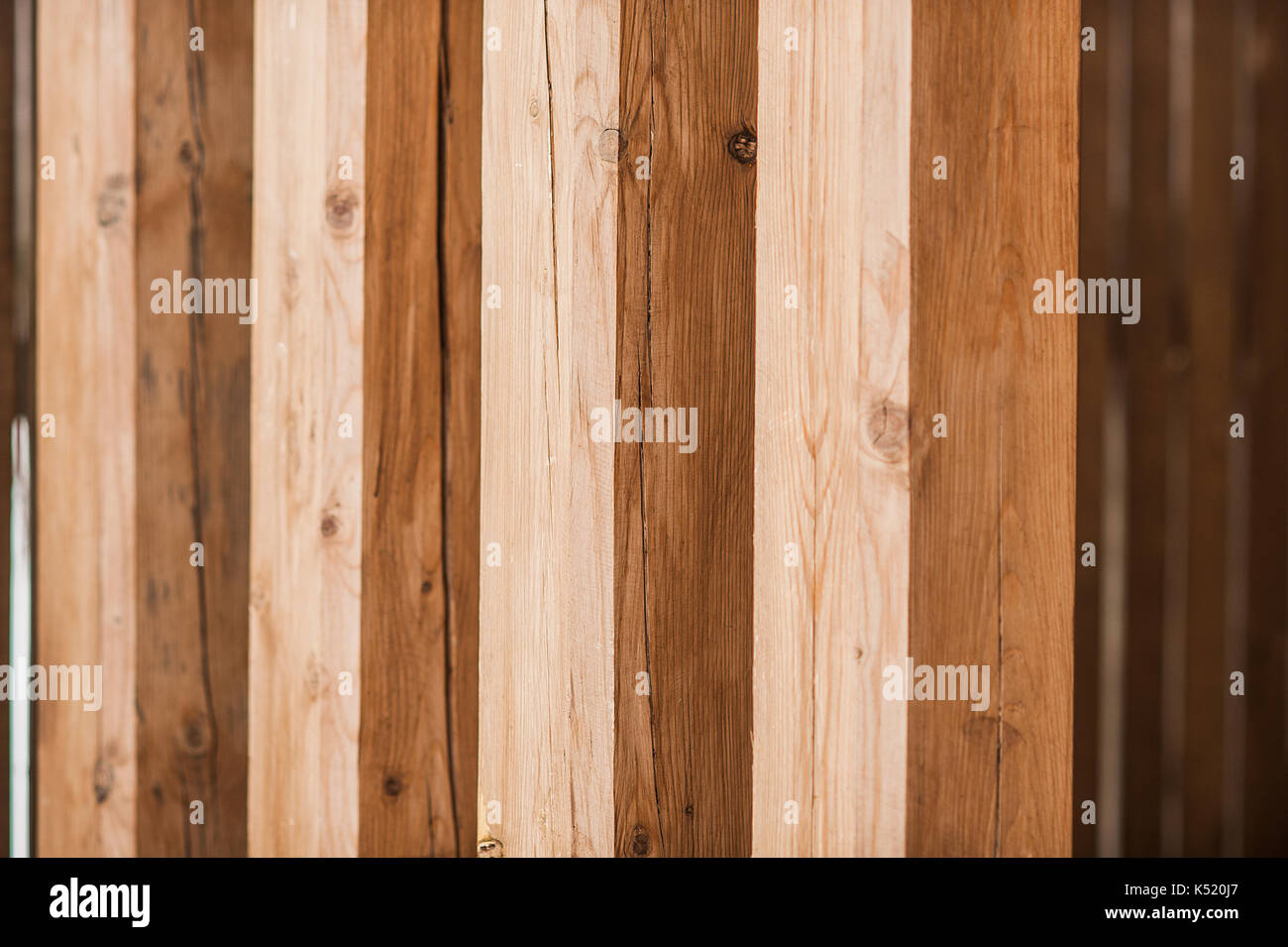 Texture - wooden boards brown color. Texture of a wooden wall from a bar. view of wooden columns Stock Photo