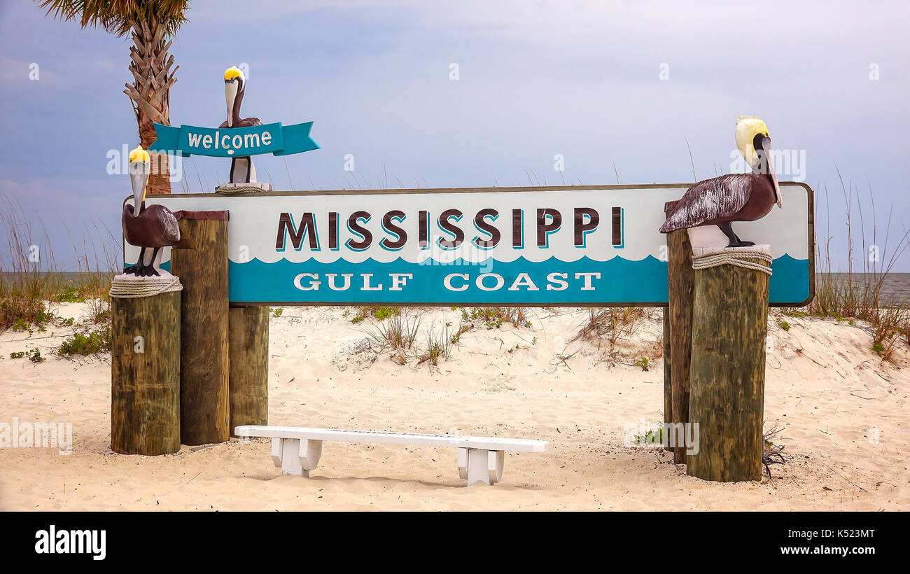 Welcome to Mississippi Gulf Coast sign on sandy beach in Gulfport Stock Photo