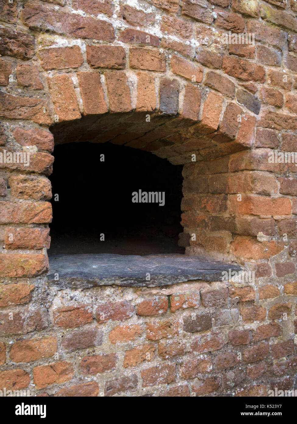 Large old red brick brick oven in kitchen in ruins of Lady Jane Grey's Bradgate House, Bradgate Park, Leicestershire, England, UK Stock Photo