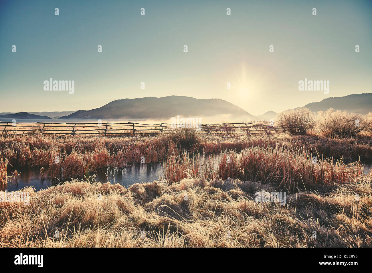 Retro toned frosty sunrise at Grand Teton National Park, Wyoming, USA. Stock Photo