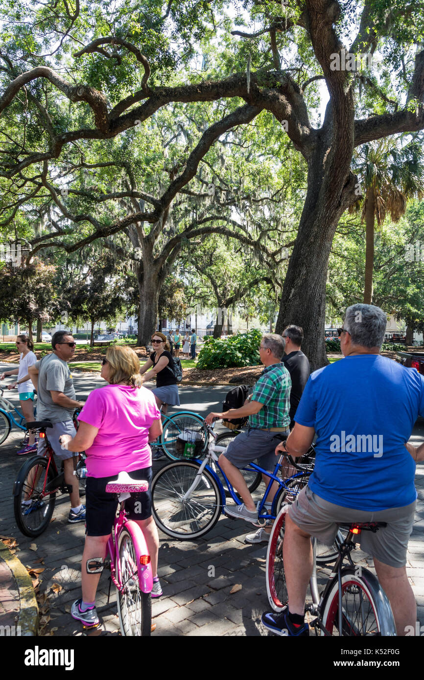 Savannah Georgia,historic district,Lafayette Square,cyclist,bicycle,guided tour,man men male,woman female women,USA US United States America North Ame Stock Photo