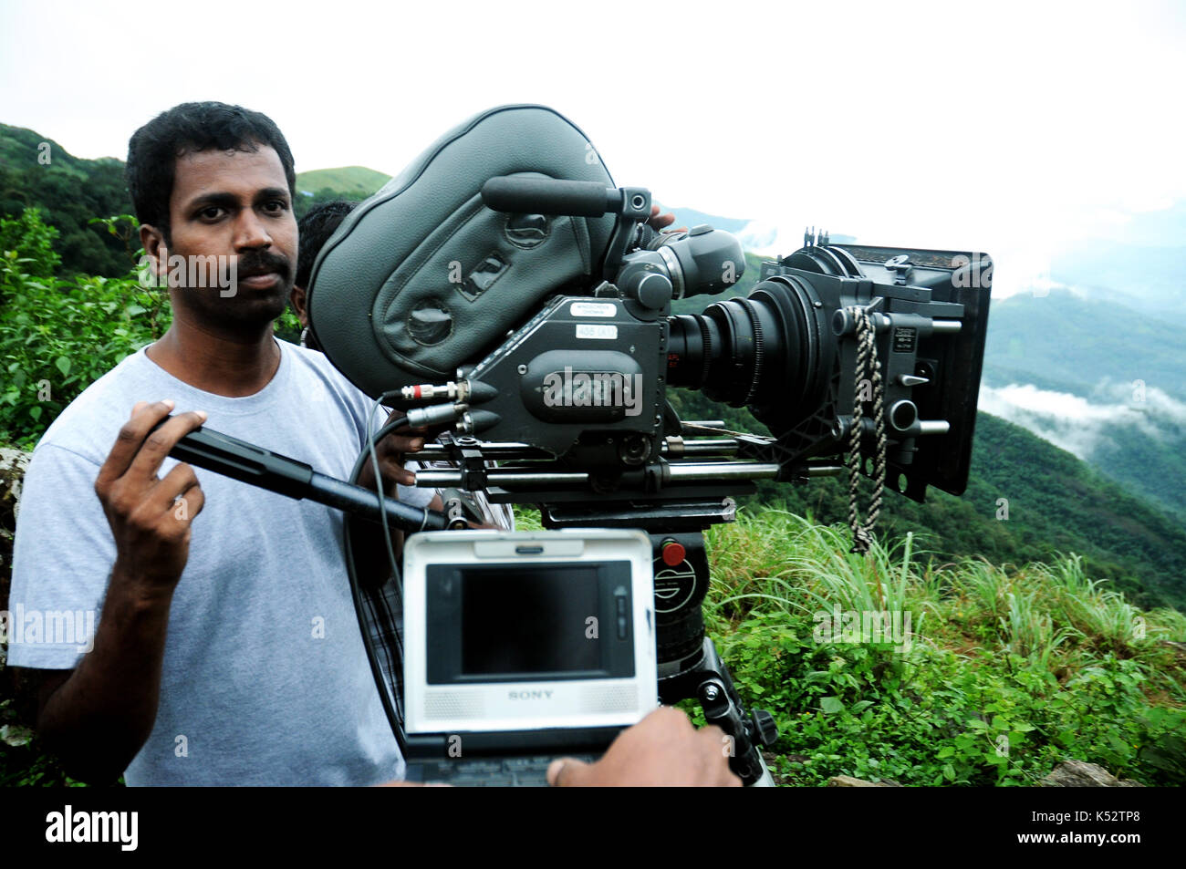 Indian film shooting spots Camera man looking camera Stock Photo - Alamy