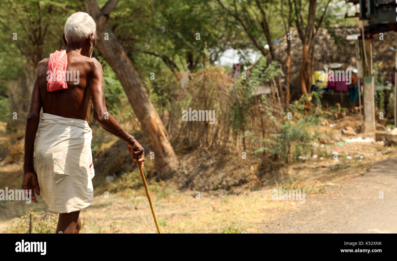 Indian man walking at the street. Stock Photo