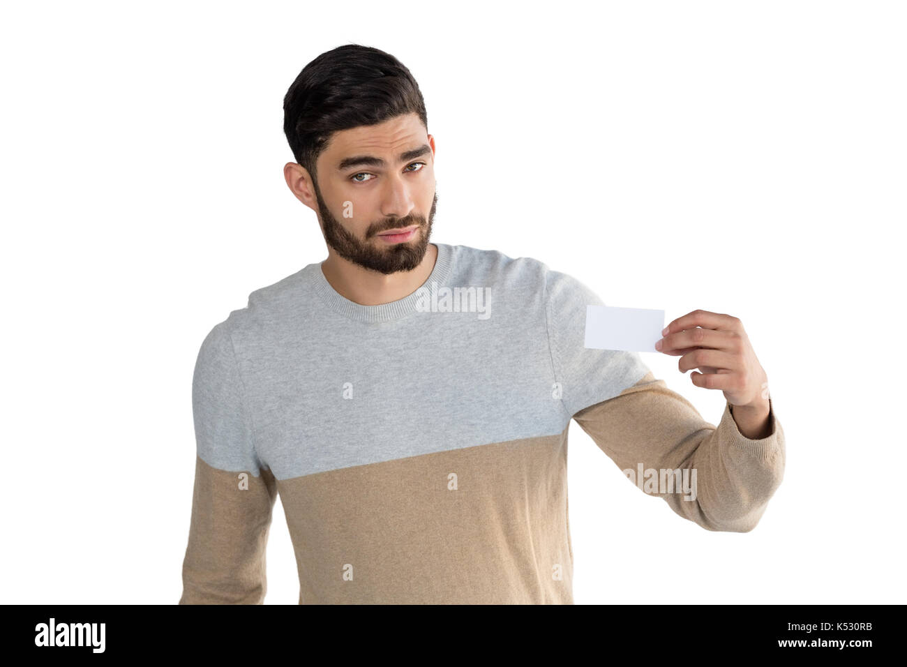 Portrait of man holding white blank card against white background Stock ...