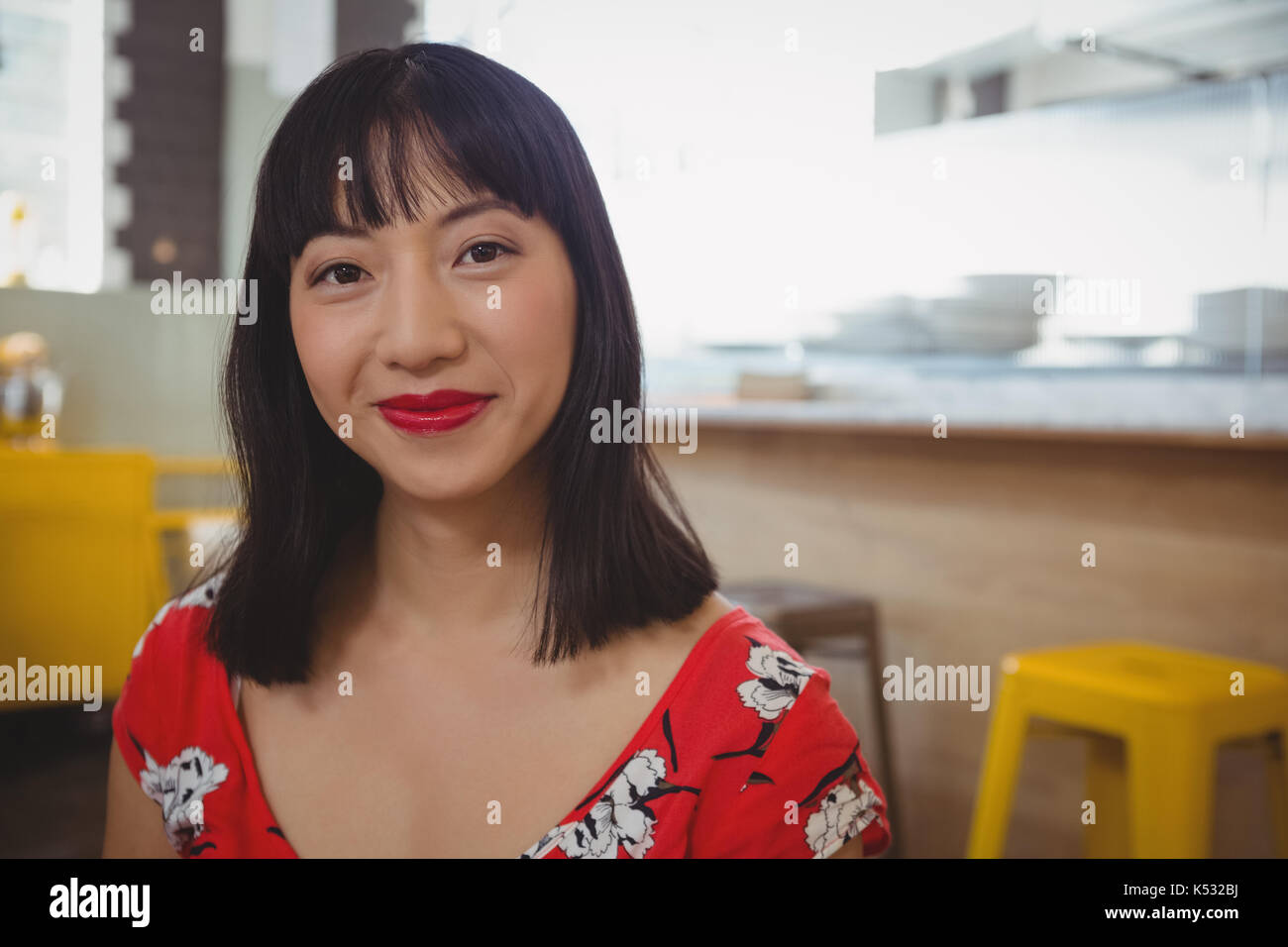 Asian woman sitting counter in hi-res stock photography and images - Alamy