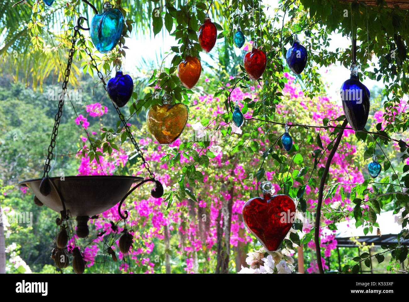 Colored Glass Hearts hanging at The Puerto Vallarta Botanical Garden - Cabo Corrients, Jalsco Mexico Stock Photo