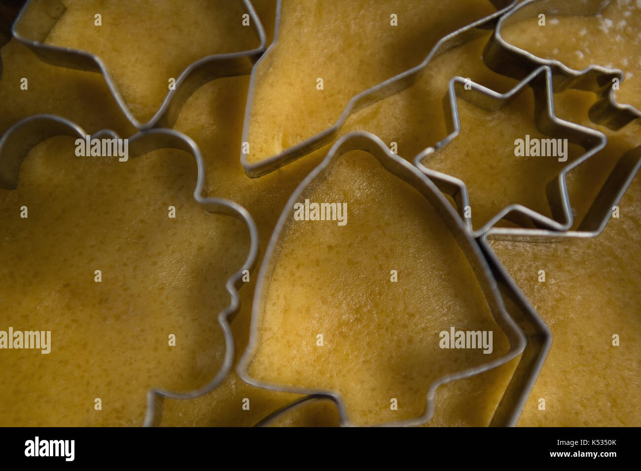 Overhead view of various shape pastry cutters on dough Stock Photo Alamy