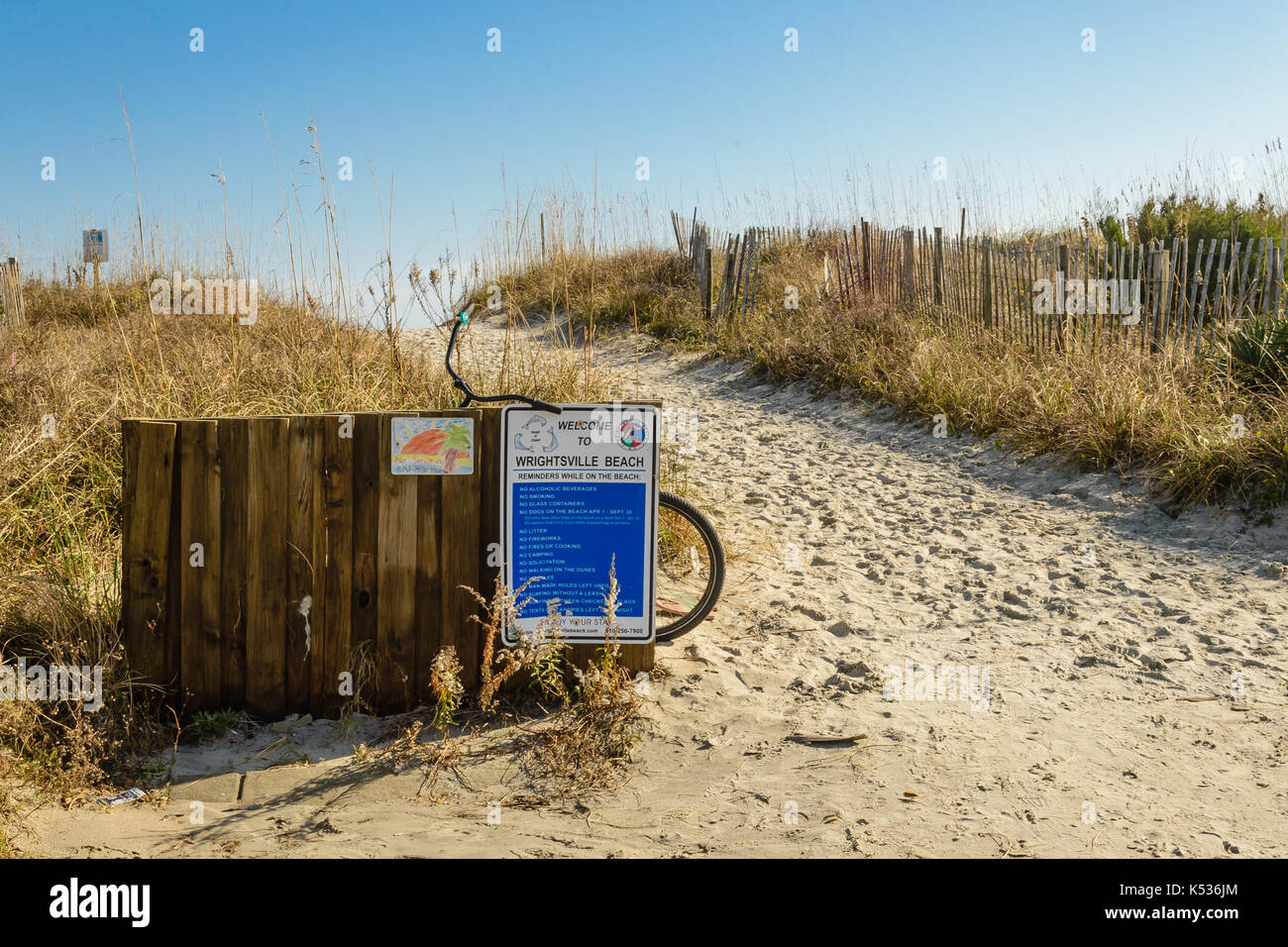 Parked bicycle outside entry to Wrightsville Beach, Wilmington, NC Stock Photo