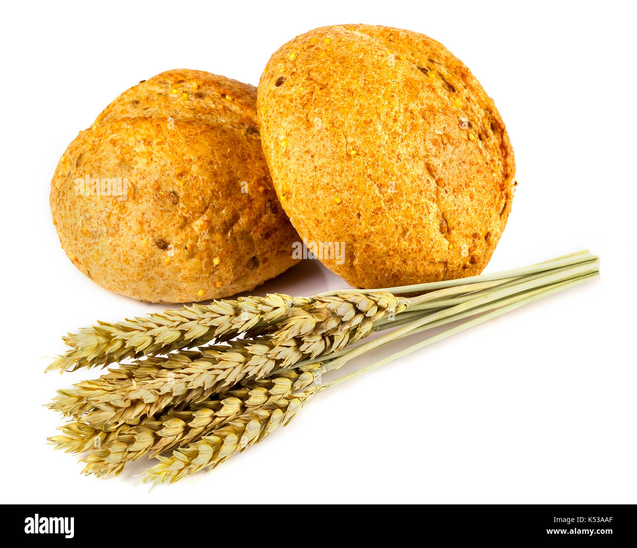 Two buns and spikelets on white background Stock Photo