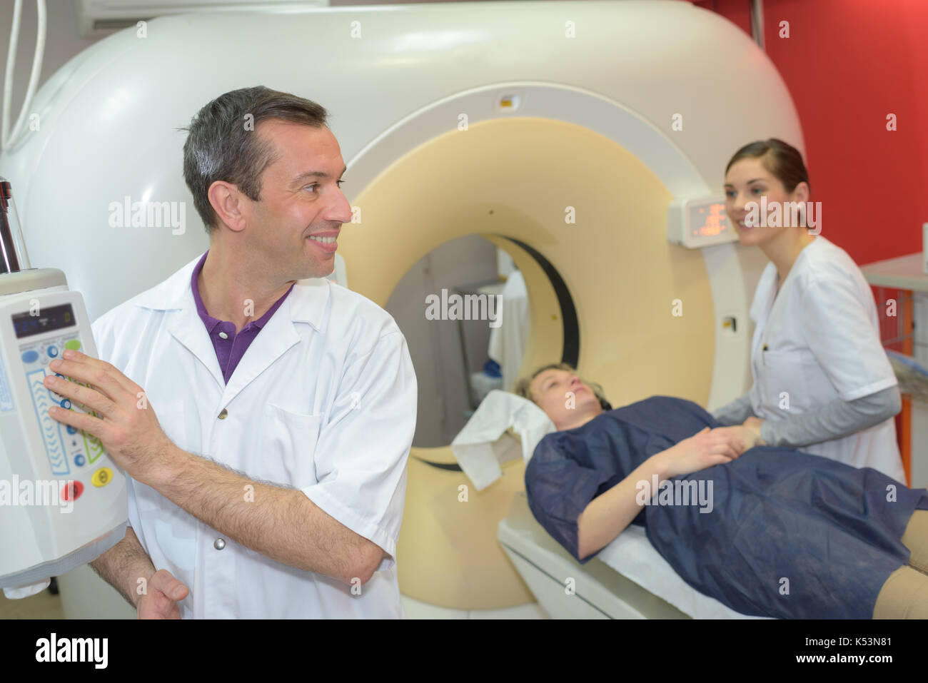 doctor and nurse examining woman with ct scanner Stock Photo