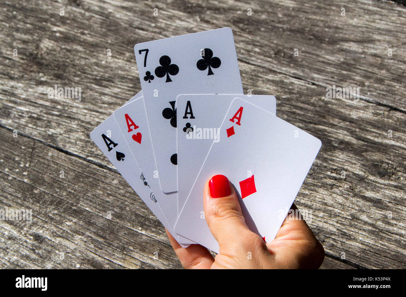 The lady plays cards. Women hand holding cards for play Stock Photo Alamy