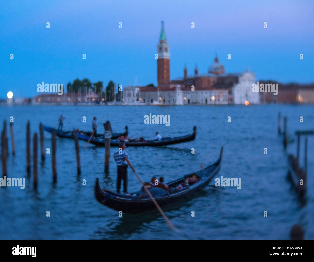 Gondolas at twilight in Venice Stock Photo - Alamy