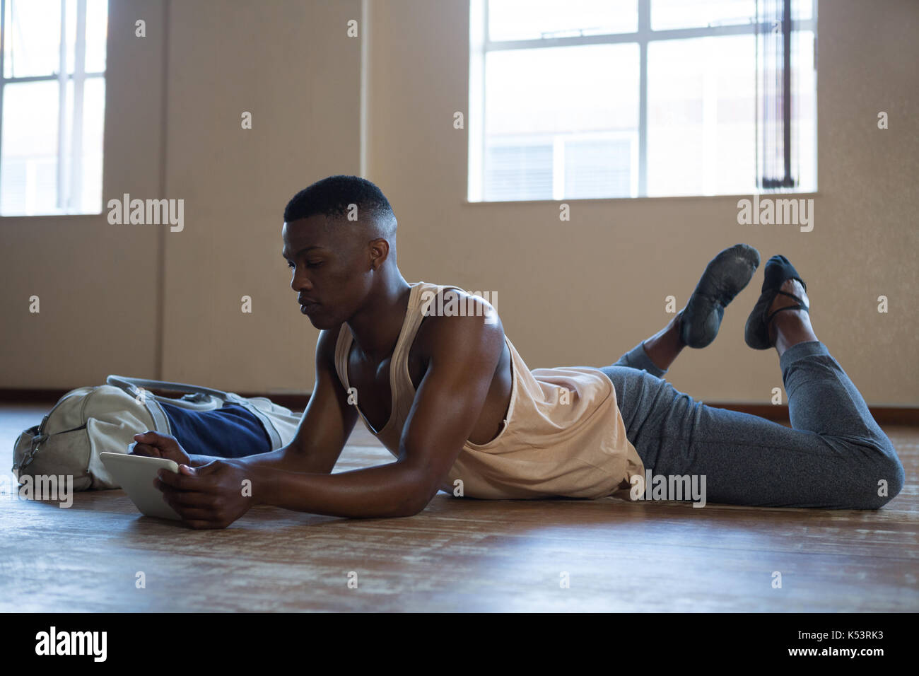 Ballerino using digital tablet in the studio Stock Photo