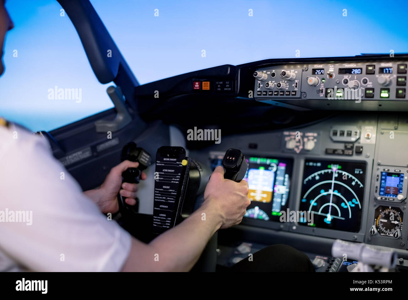 Cropped image of young male pilot holding steering wheel in airplane  cockpit Stock Photo - Alamy