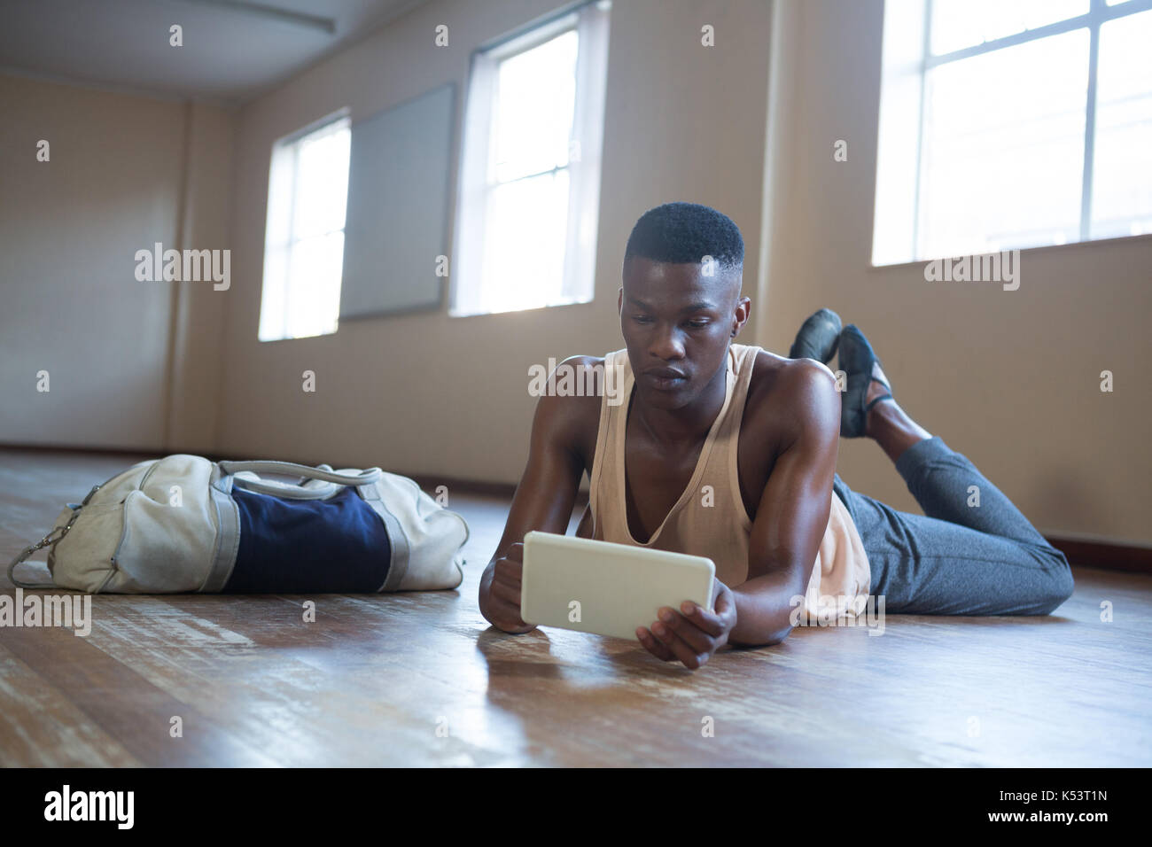 Ballerino using digital tablet in the studio Stock Photo