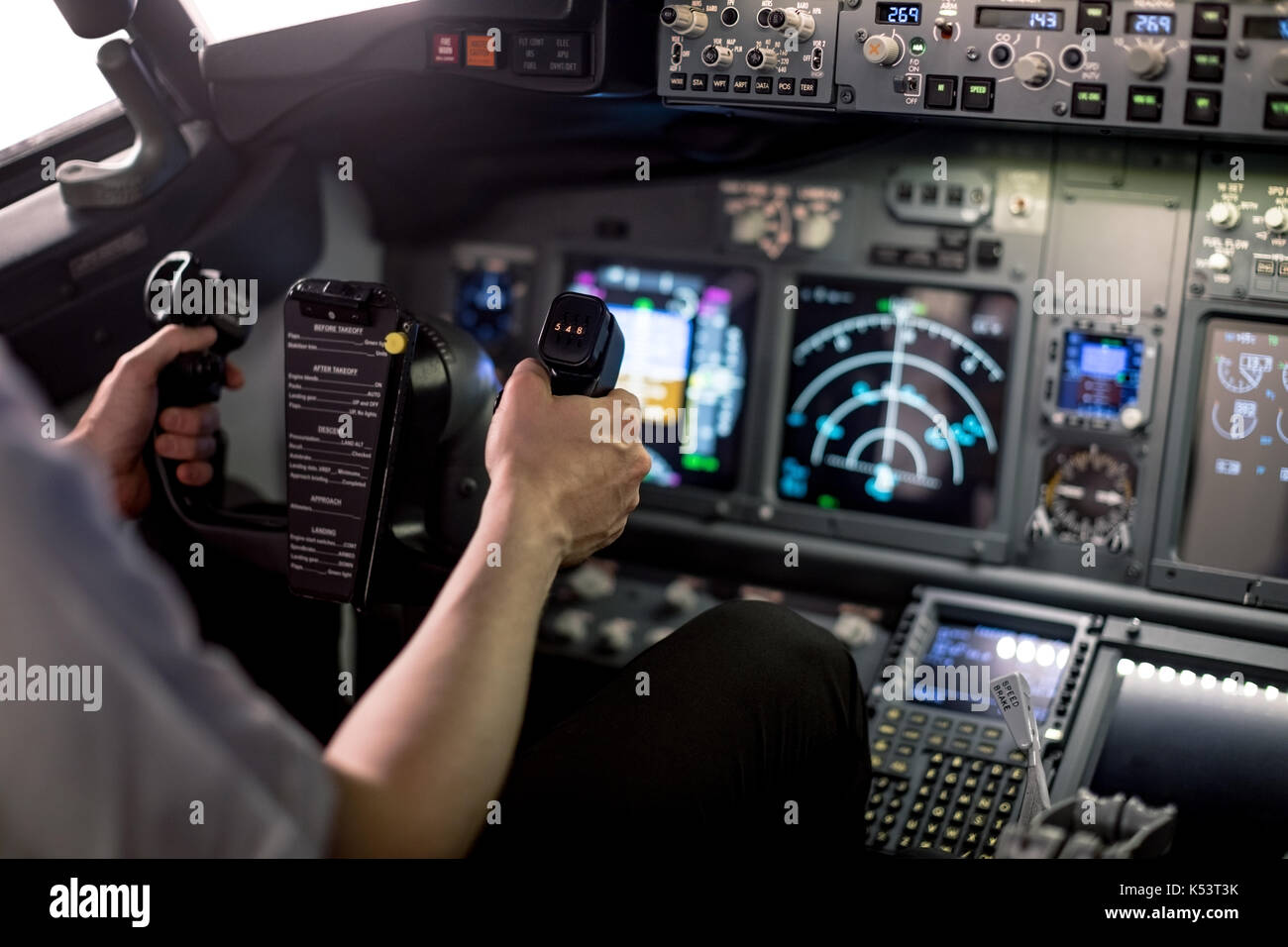 Cropped image of male pilot holding steering wheel in airplane cockpit Stock Photo Alamy