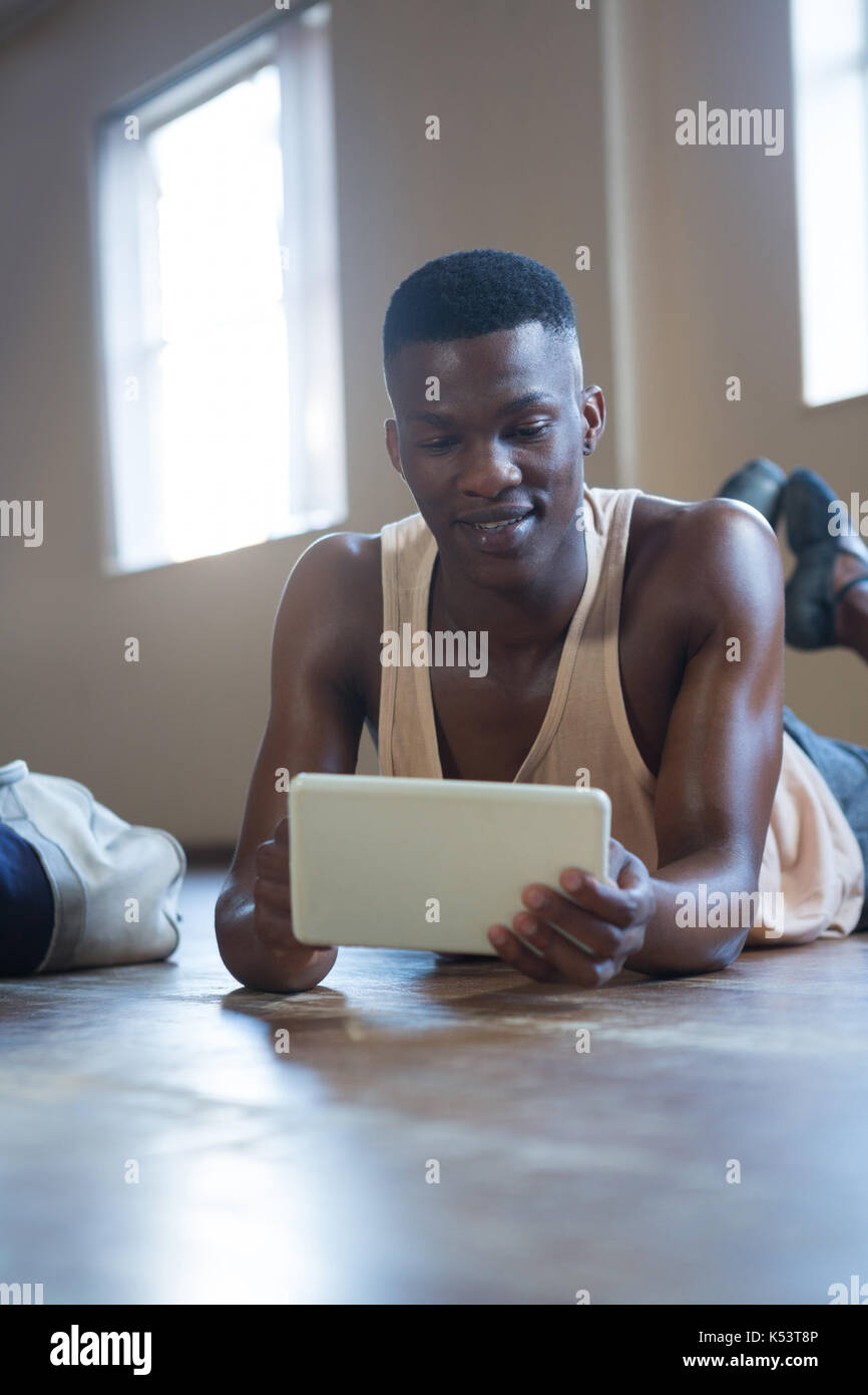 Ballerino using digital tablet in the studio Stock Photo