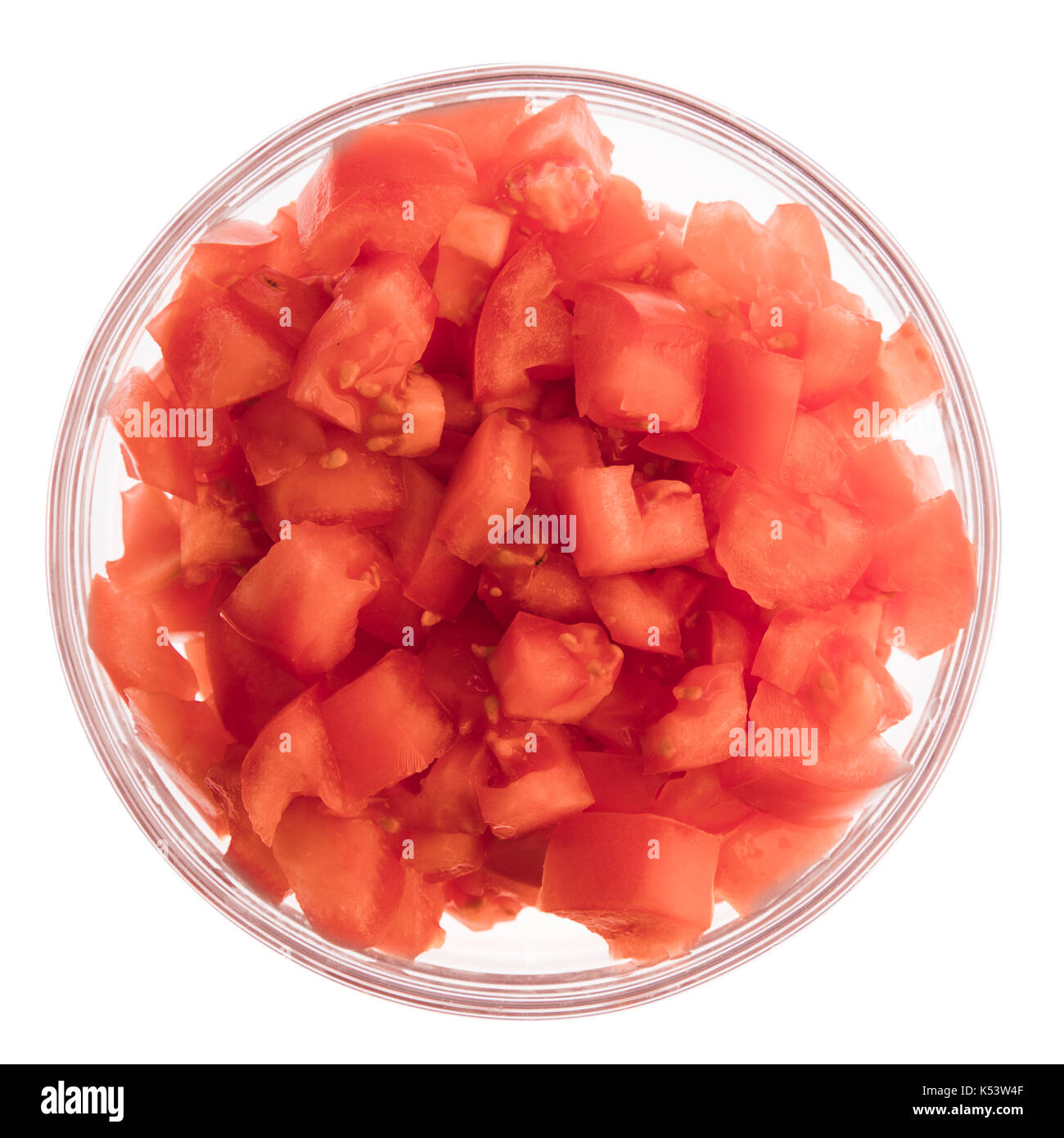 Chopped tomatoes in glass bowl isolated on white and viewed from above