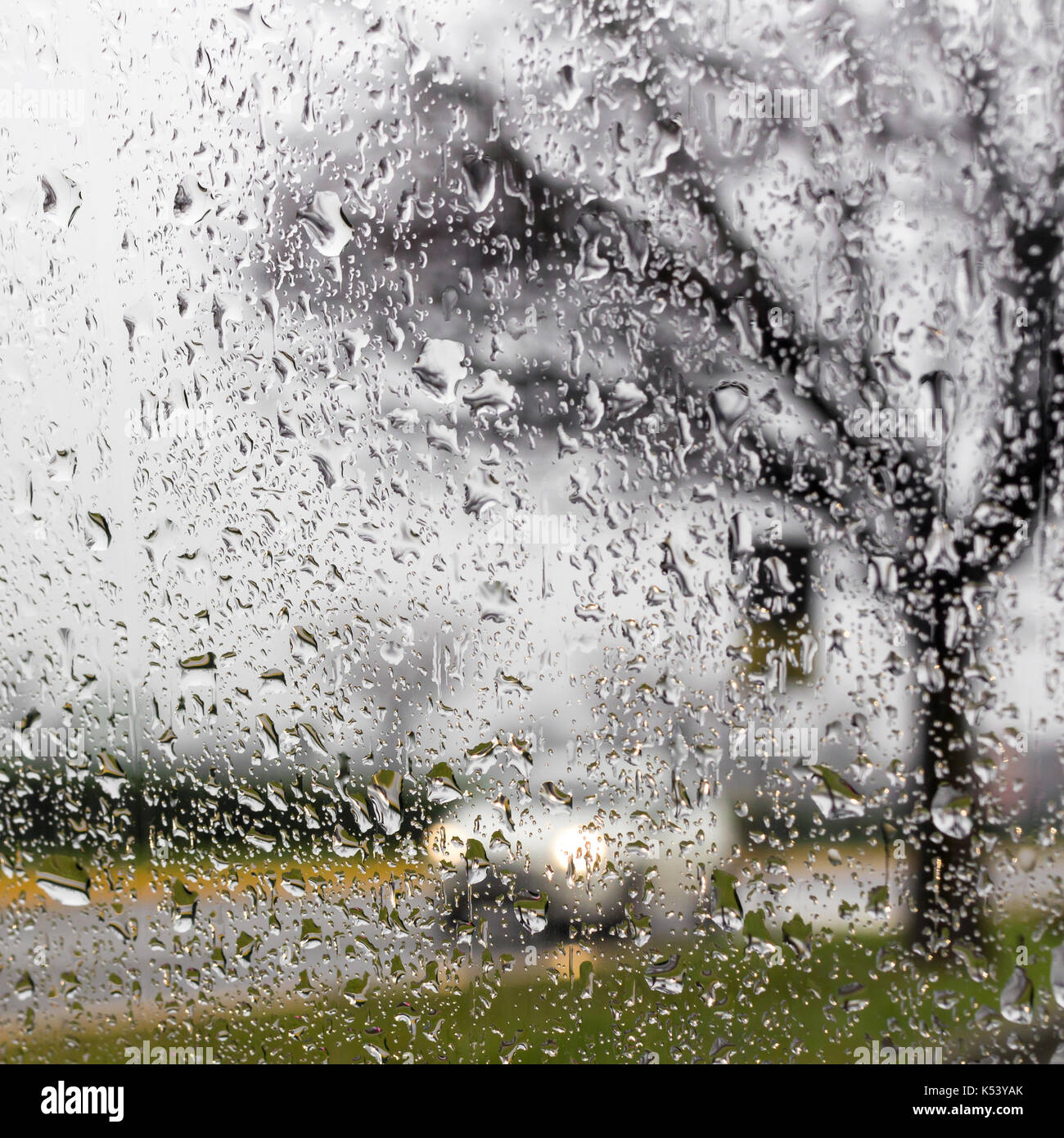 Driving in rain. Raining and wet weather driving conditions on the road, traffic blurred