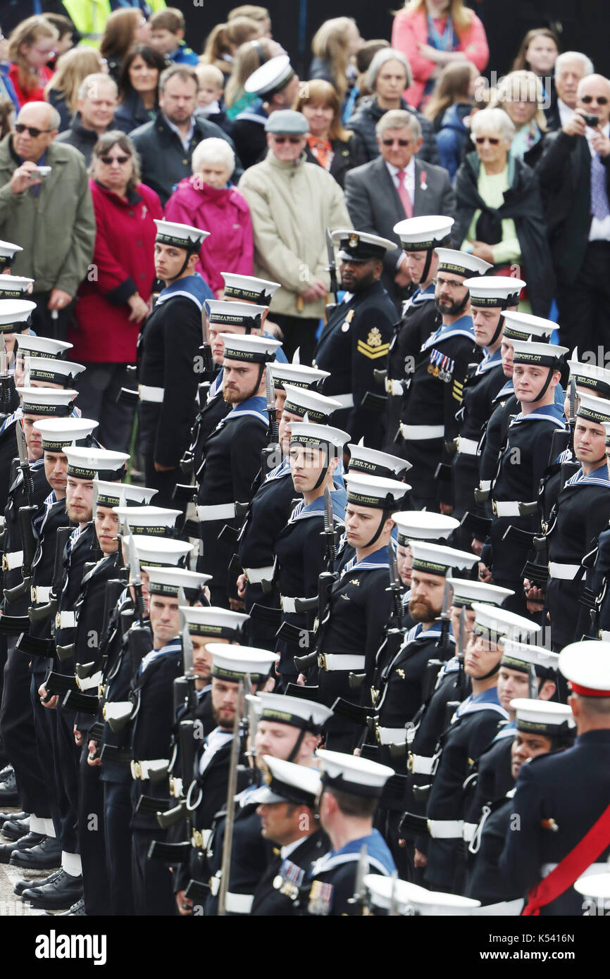 Members of the Royal Navy attend a naming ceremony of aircraft carrier HMS Prince of Wales at the Royal Dockyard in Rosyth. Stock Photo