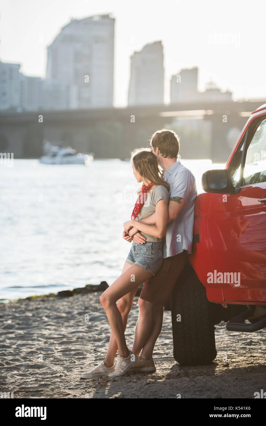 Young couple hugging riverside hi-res stock photography and images - Alamy