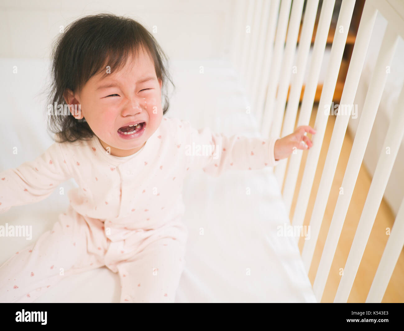 Crying baby cot hires stock photography and images Alamy