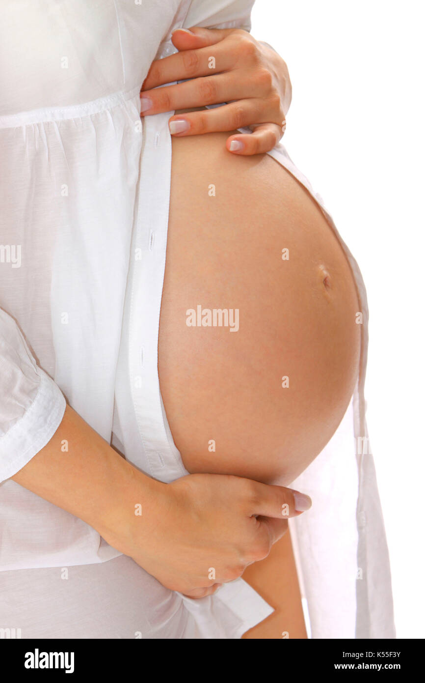Closeup of a pregnant young woman's belly Stock Photo