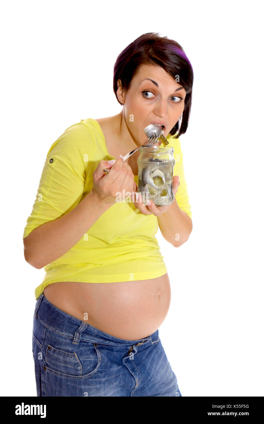 Pregnant woman eats a sour Bismarck herring Stock Photo