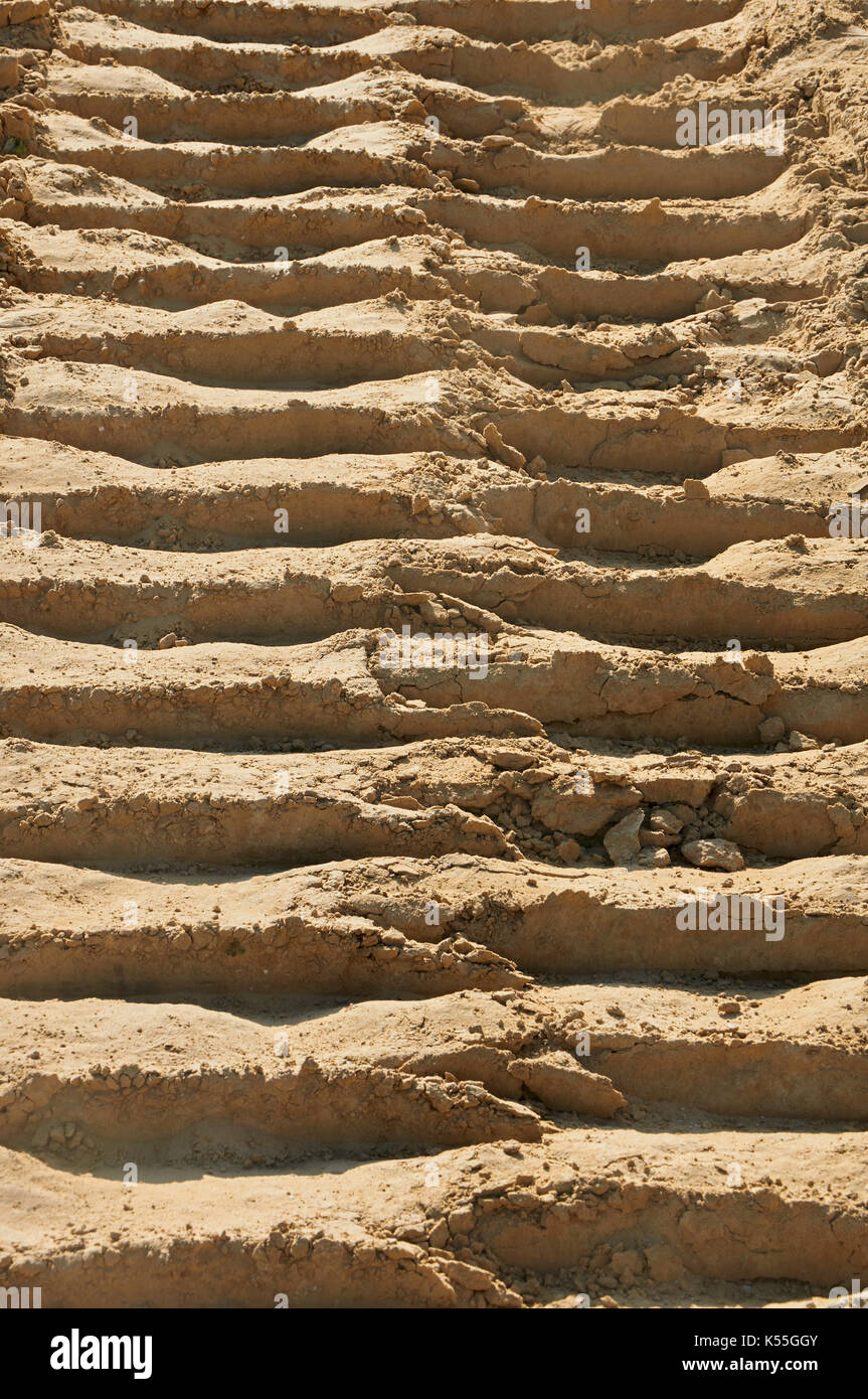 Career tip lorry tire prints on the yellow sand in quarry Stock Photo