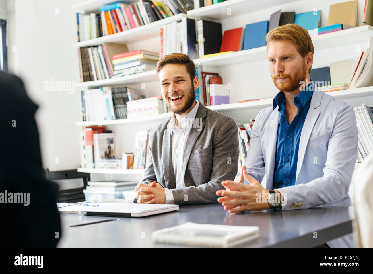Two happy male colleagues hi-res stock photography and images - Alamy