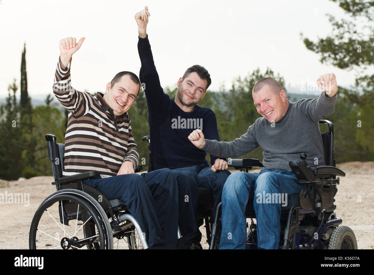 Disabled Happy friends  with thumbs up. Stock Photo