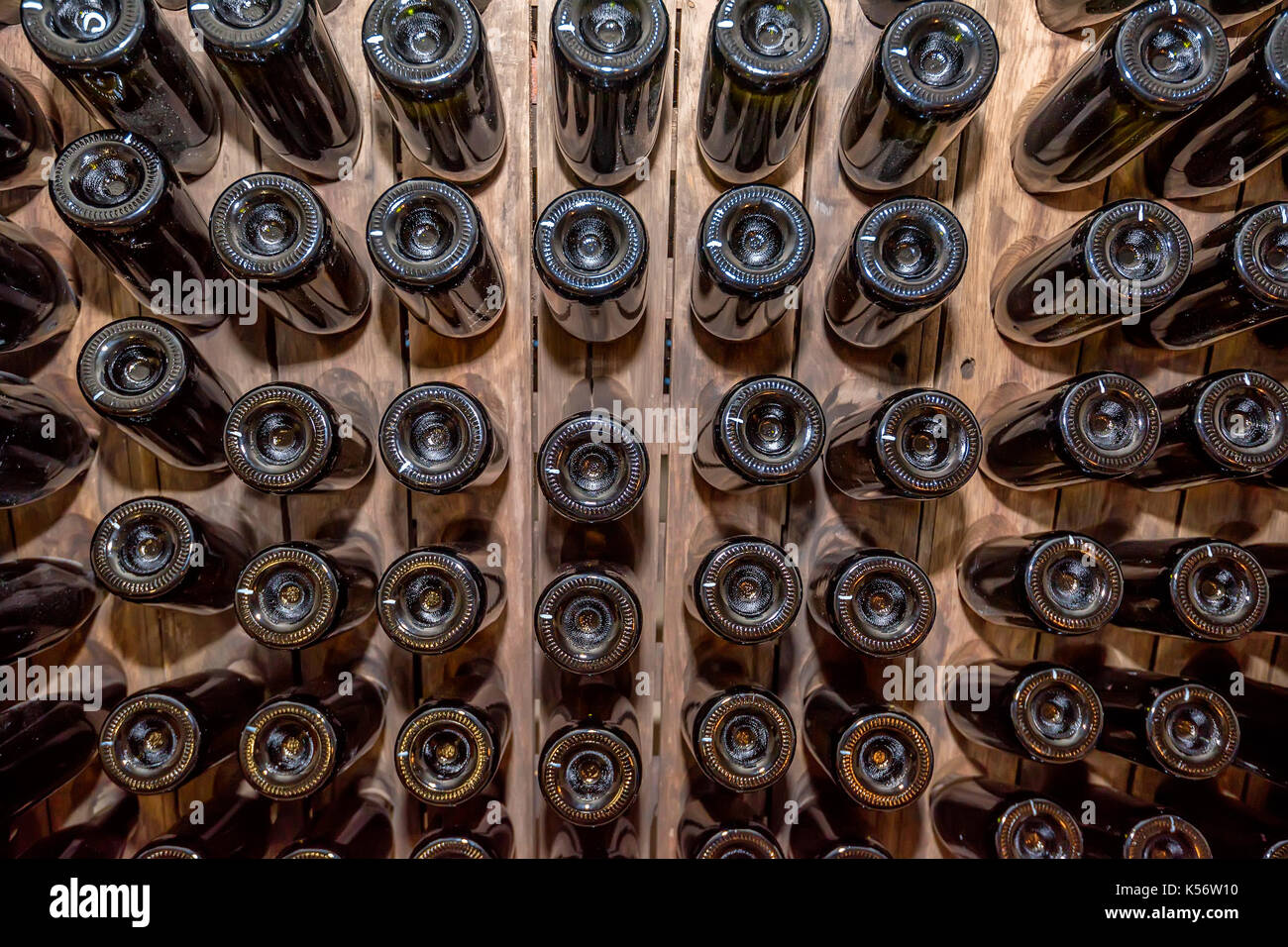 Bottoms of wine bottles stacked in cellar Stock Photo Alamy